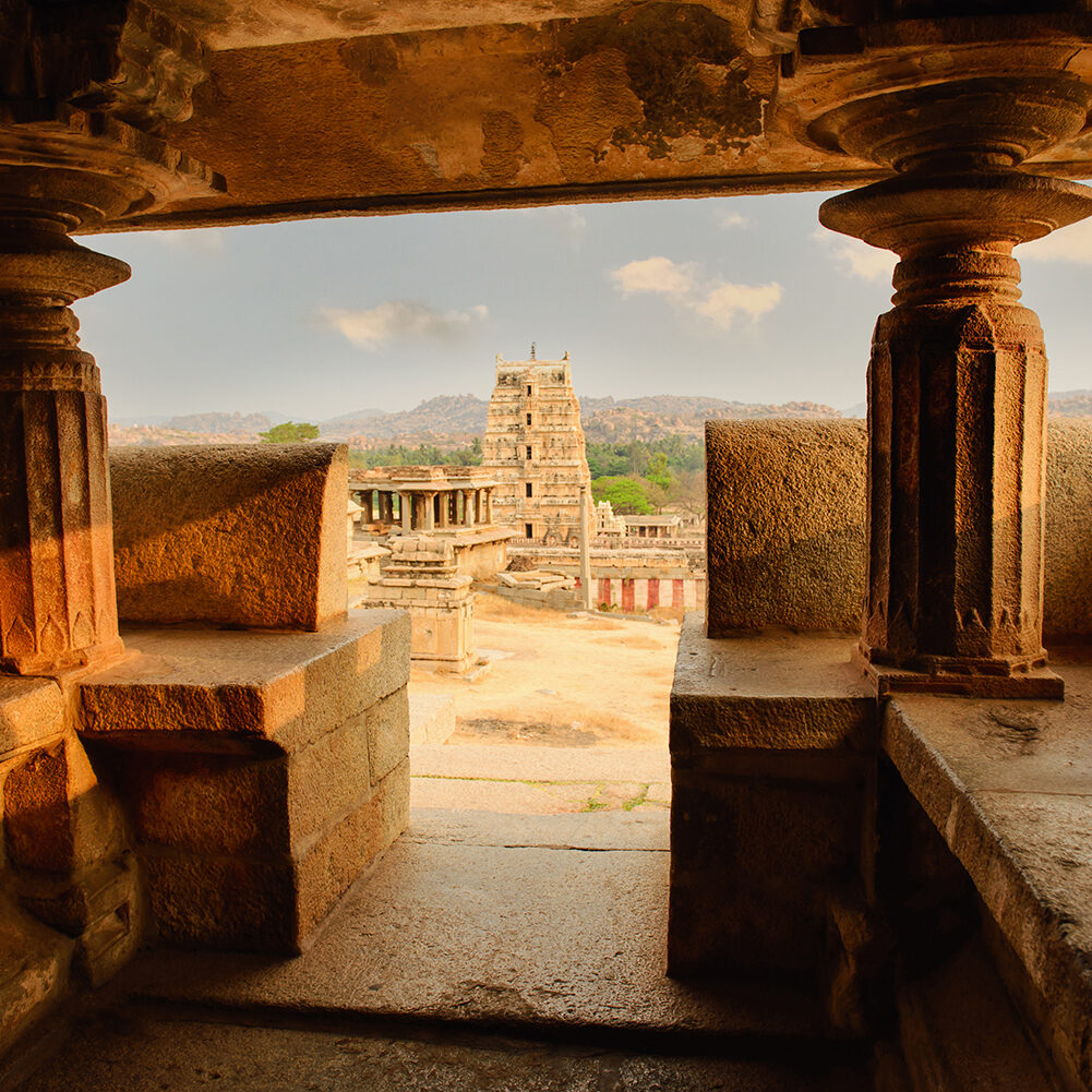 Beautiful architecture of ancient ruins of temple in Hampi at sunset, Karnataka, India